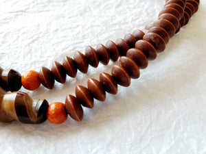 Carved Spiral Horn Bone Cone-shaped Orange Copal Amber Resin Polka Dot Batik Bone Bead Necklace, The Clove